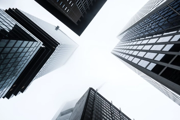 Skyscrapers viewed from below, symbolizing corporate innovation and growth