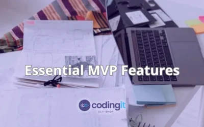 A workspace with a laptop, notes, and plans, representing the process of defining essential MVP features with CodingIT’s logo under it