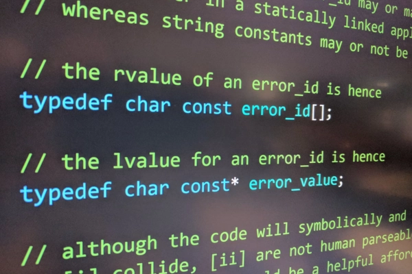 A close-up of computer code displaying highlighted syntax and error messages