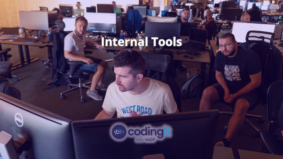 Developers working in an open office, focused on internal tools