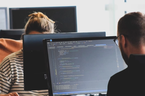 Software developers focused on coding at their desks